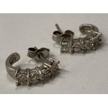 9CT WHITE GOLD HALF HOOP CUFF STYLE EARRINGS SET WITH FOUR DIAMONDS IN A CLAW SETTING COMPLETE
