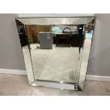 A MODERN BEVELLED GLASS WALL MIRROR IN BEVELLED GLASS FRAME 102 X 83CM