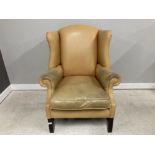 A GEORGE III STYLE WINGBACK ARMCHAIR IN MUSTARD YELLOW LEATHER RE-UPHOLSTERED BY DOWNS FURNITURE OF