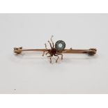 9CT YELLOW GOLD BROOCH WITH SPIDER SET WITH RED AND BLUE STONES 1.9G GROSS