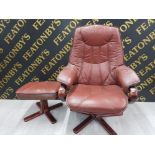 A STRESSLESS STYLE RED LEATHER ARMCHAIR AND FOOTSTOOL