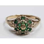 9CT YELLOW GOLD EMERALD AND DIAMOND CLUSTERING SET WITH A SINGLE DIAMOND ON THE SHOULDERS 1.9G GROSS