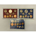 THREE COIN SETS IN HARD PLASTIC CASES INCLUDES COINAGE OF GREAT BRITAIN AND BRITAINS FIRST ISSUE