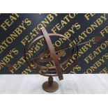 A WROUGHT IRON ARMILLARY SPHERE SCROLL DESIGN 66CM HIGH