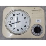 A RETRO STYLE PLASTIC WALL CLOCK WITH TIMER