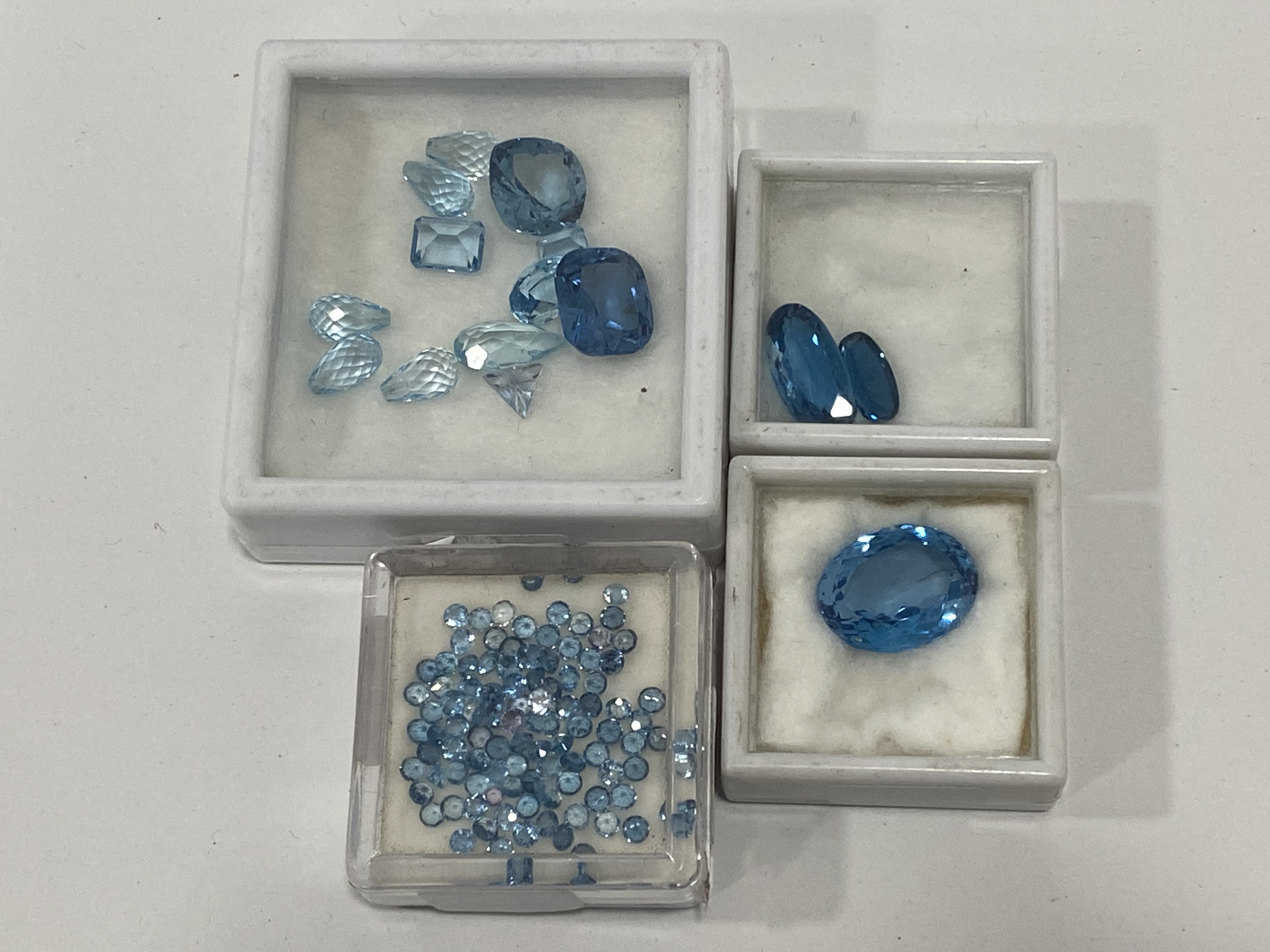 LARGE AMOUNT OF MIXED BLUE TOPAZ - VARIOUS CUTS, SIZES AND SHAPES