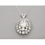 BEAUTIFUL 18CT WHITE GOLD DIAMOND CLUSTER PENDANT 6.5CTS TOTAL COMPRISING OF A 2CT OVAL DIAMOND