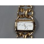 A LADIES GOLD PLATES DKNY WRISTWATCH, NEW BATTERY FITTED