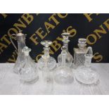 A LOT OF GEORGIAN AND LATER DECANTERS ALL WITH STOPPERS INCLUDES SILVER PLATED AND CRYSTAL SHIPS