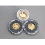 A SET OF 3 22CT GOLD LONDON MINT ELIZABETH AND THE LION COINS IN CASE OF ISSUE TOTAL WEIGHT OF 8G