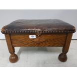 AN OAK AND LEATHER FOOT STOOL WITH STORAGE 44 X 26 X 33CM