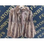 A LADIES FUR JACKET BY MARCUS SIZE 12 APPROX