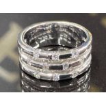 A 14CT WHITE GOLD AND DIAMOND FANCY BAND SET WITH .35CTS BRILLIANT CUT DIAMONDS SIZE K 1/2 7.3G