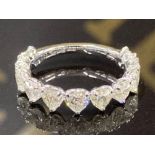 AN 18CT WHITE GOLD AND DIAMOND 2/3 ETERNITY RING THE HEART CUT DIAMONDS TOTALLING 2.89CTS VS CLARITY