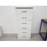 A WHITE PAINTED TALL BOY WITH CHROME HANDLES 6 DRAWERS 62 X 144.5 X 50CM