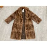 A LADIES 3/4 LENGTH FUR COAT BY M FLETCHER LTD SOUTHPORT SIZE 12 APPROX