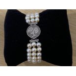 A C1920 NATURAL FRESHWATER PEARL THREE ROW BRACELET THE ROSE PATTERN PLATINUM CLASP SET WITH