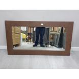 A MODERN RECTANGULAR SHAPED WALL MIRROR IN LEATHER EFFECT FRAME 70 X 130CM