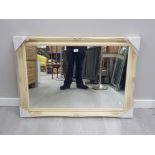 A MODERN RECTANGULAR SHAPED WALL MIRROR IN CREAM ORNATE SWEPT FRAME 75 X 105CM