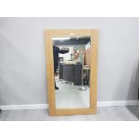 A MODERN WALL MIRROR IN OAK EFFECT FRAME 140 X 80CM