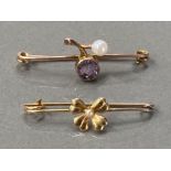 TWO ANTIQUE YELLOW METAL BROOCHES ONE WITH PURPLE STONE AND PEARL THE OTHER FOUR LEAF CLOVER 2.5G