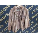 A LADIES FUR JACKET BY MARCUS SIZE 12 APPROX