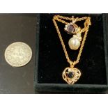 THREE GOLD PLATED PENDANTS GARNET SAPPHIRE AND PEARL ON CHAINS AND 1881 GERMAN 1 MARK COIN