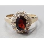9CT GOLD GARNET AND CZ CLUSTER RING 2.1G GROSS SIZE- J 1/2