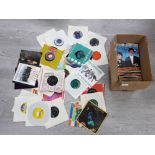 BOX OF 45 RPM RECORDS INCLUDING STEVIE WONDER, QUEEN AND DAVID BOWIE UNDER PRESSURE AND MADNESS IT