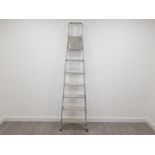 A SET OF ALUMINIUM 7 STEP LADDERS