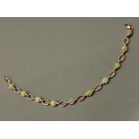 SILVER AND TEN OPAL SET LINE BRACELET, 4.9G GROSS