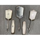 A FIVE PIECE SILVER BACKED DRESSING TABLE SET BY HENRY BUSHELL AND CO BIRMINGHAM 1931 COMPRISING 2