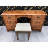 A PINE DRESSING TABLE WITH SIX DRAWERS 131CM WIDE TOGETHER WITH A STOOL