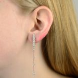 A pair of brilliant-cut diamond tapered drop earrings,