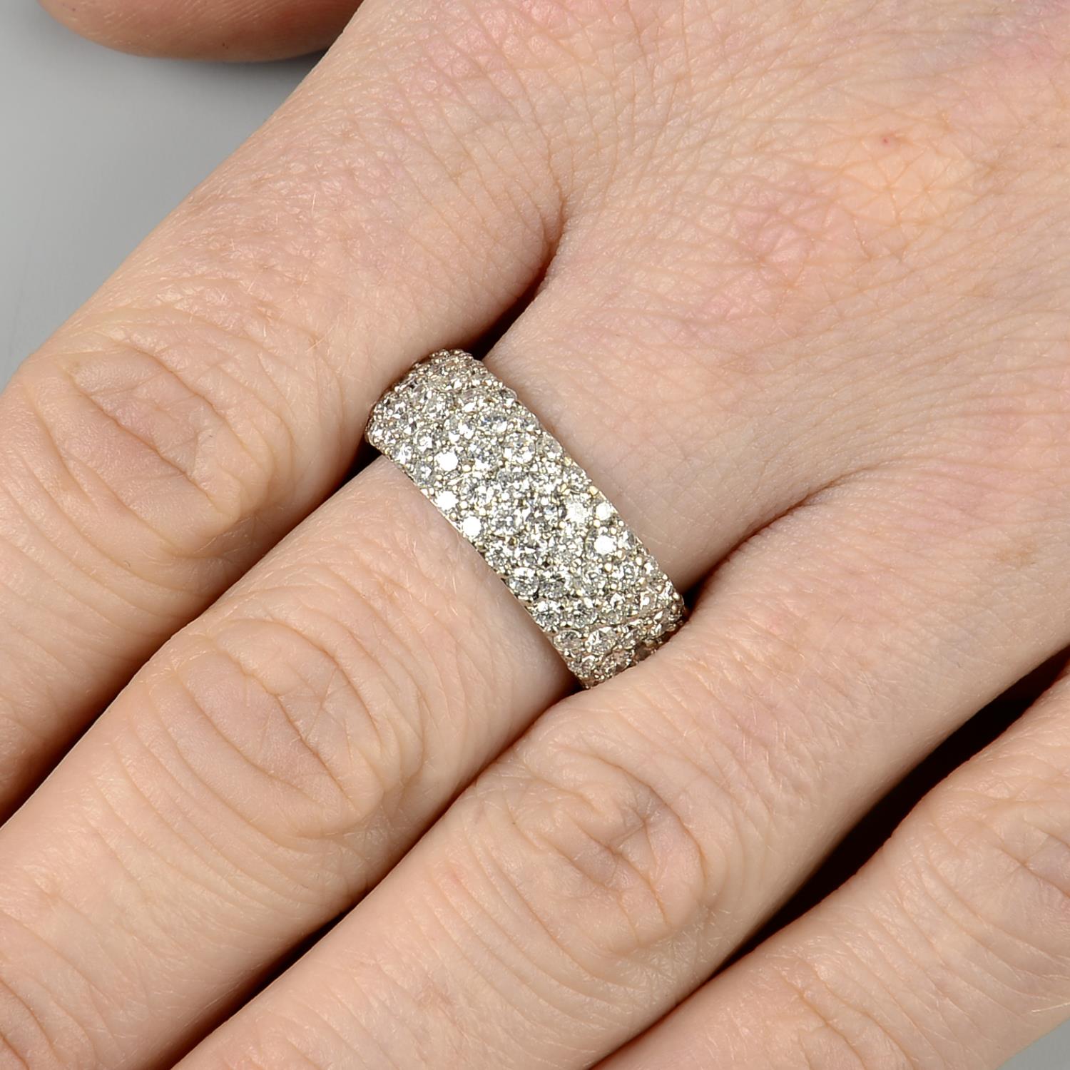 An 18ct gold pave-set diamond full eternity ring.Estimated total diamond weight 4.25cts,