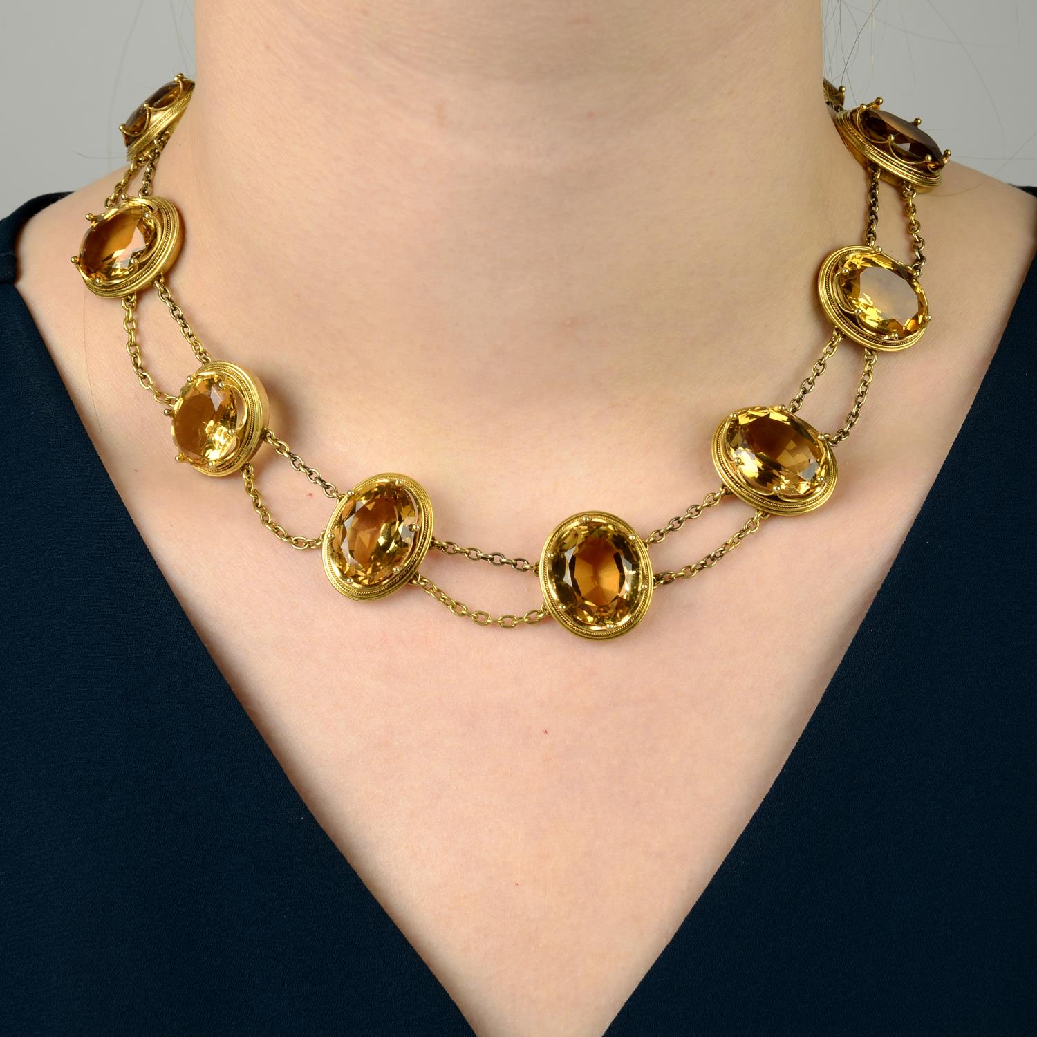 A late Victorian gold citrine necklace.Central citrine calculated weight 14.46cts,