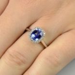 A sapphire and diamond cluster ring.