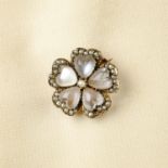 An Edwardian gold moonstone and split pearl floral brooch.Diameter 2cms.