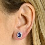 A pair of sapphire and diamond cluster earrings.