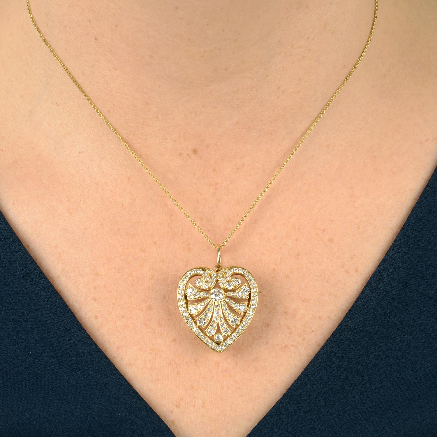 An old-cut diamond openwork heart pendant, with later 18ct gold chain.