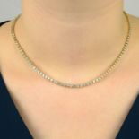 An 18ct gold graduated brilliant-cut diamond line necklace.Total diamond weight 7.08cts,
