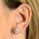 A pair of old-cut diamond floral cluster stud earrings.Estimated total diamond weight 1ct,