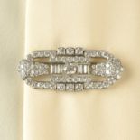 An Art Deco platinum brilliant and baguette-cut diamond brooch, by A.E.