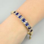 A late Victorian 15ct gold Burmese sapphire and diamond hinged bangle.With report 80239-72,