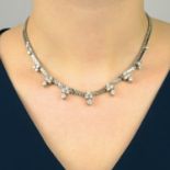 A diamond cluster fringe necklace.