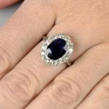 A sapphire and old-cut diamond cluster ring.