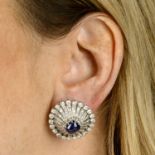 A pair of cushion-shape sapphire cabochon and vari-cut diamond cluster earrings.Estimated total