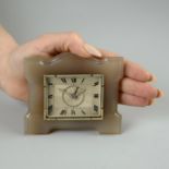 An Art Deco agate French desk clock, with diamond hands, attributed to Boucheron.Length 9.6cms.