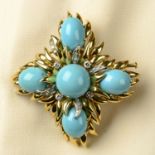 An 18ct gold turquoise and diamond floral pendant.May be worn as a brooch.Estimated total diamond