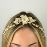 An early Victorian 9ct gold seed pearl floral tiara and knot brooch.Length of tiara 46.3cms.